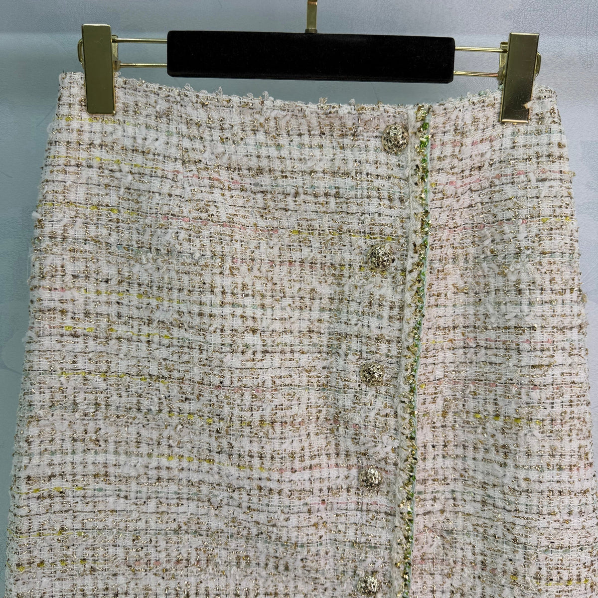 A light beige tweed blend short-sleeved jacket